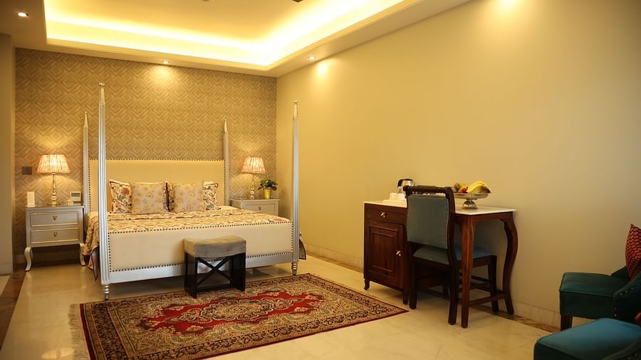 A room at Dileep Kothi, Jaipur with a double bed and a work desk and chair
